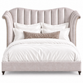 The Moira California King bed is upholstered in Shimmer Amethyst with old gold tack detail and dark walnut leg.  Made in the USA