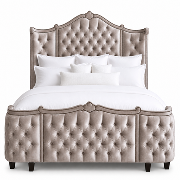 A luxury tufted velvet bed frame in a warm amethyst color, with old gold tack detail.  Made in the United States and fully customizable 