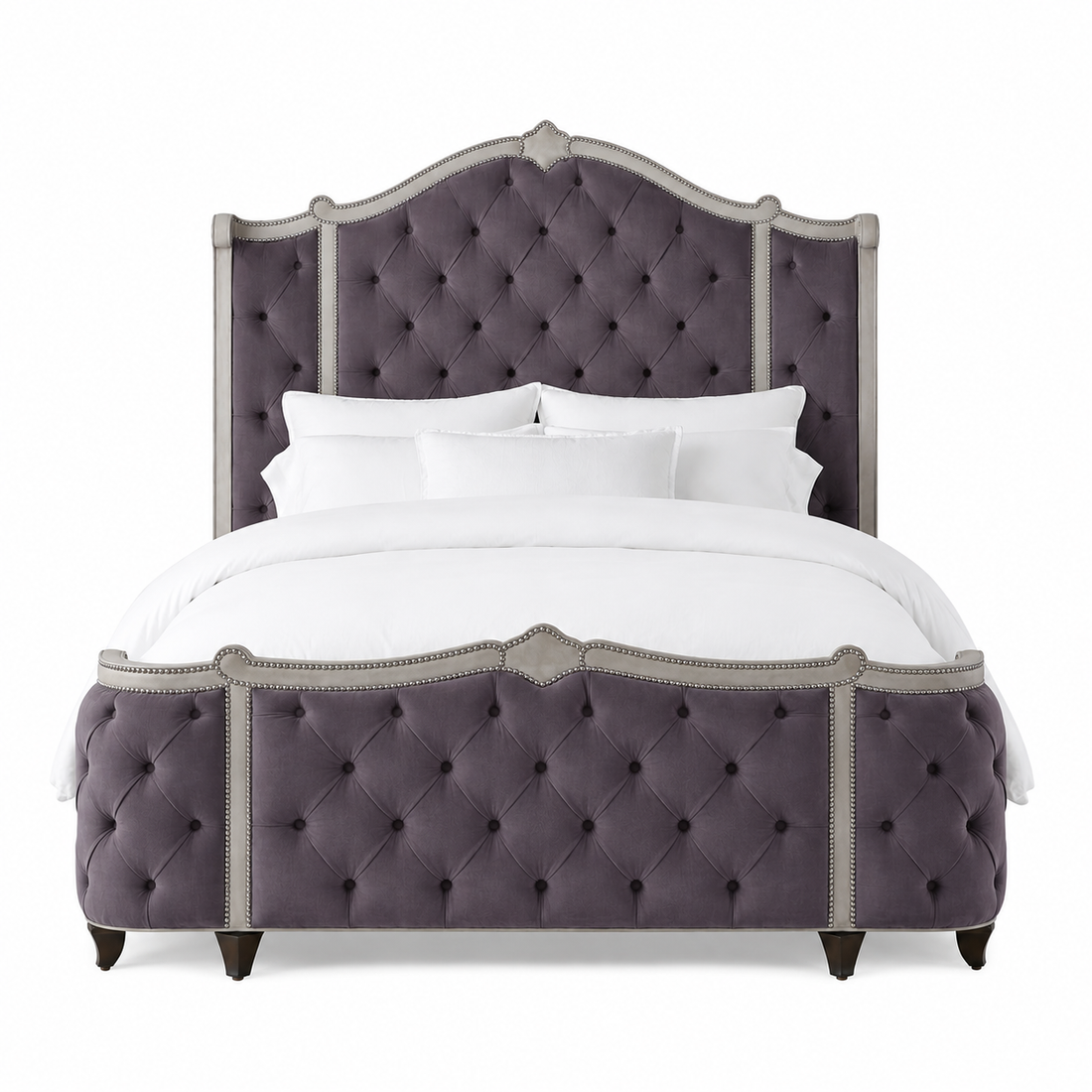 A luxury upholstered bed featuring a tall, tufted headboard and matching footboard in a dusty purple fabric with brushed nickel tacks.  Made in the United States and fully customizable 