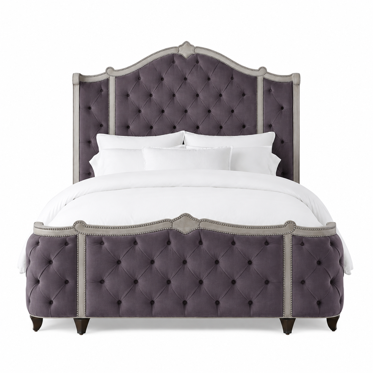 A luxury upholstered bed featuring a tall, tufted headboard and matching footboard in a dusty purple fabric with brushed nickel tacks.  Made in the United States and fully customizable 